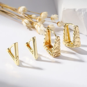 Polished gold geometric earrings with V-shape and embossed rectangular designs
