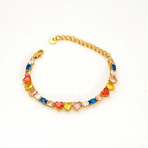 Detail of gold-plated stainless steel tennis bracelet with multi-colored heart zircons