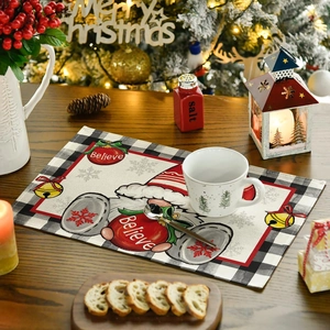 Christmas placemat with Believe lettering and Santa Claus on buffalo check background