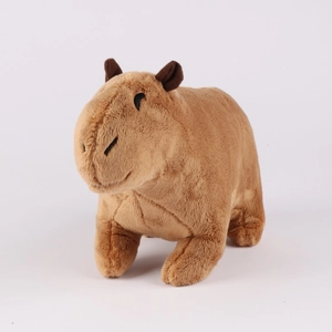 Close-up of the soft brown plush fur and stitching details of the Capybara stuffed animal