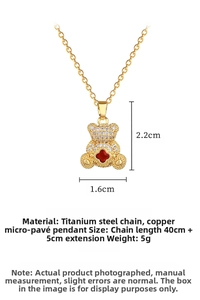 Detailed view of titanium teddy bear pendant with red clover inlay and pavé crystals