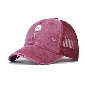 Distressed burgundy baseball cap with mesh back and daisy embroidery for sun protection