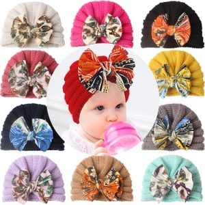 Detailed collage of colorful baby turban hats with large bows in 11 vibrant shades