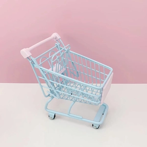 Miniature blue and pink wire desktop organizer shopping cart for office snacks and decor
