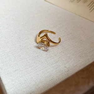 Close-up of 18k gold plated teardrop ring featuring a large sparkling round zircon