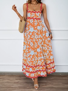 Detailed view of the orange floral print summer maxi dress with red scalloped trim detailing