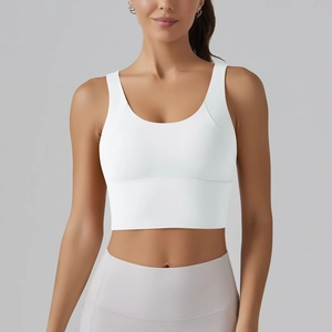 Close-up of white high-elastic yoga sports bra with wide straps and U-neckline detail