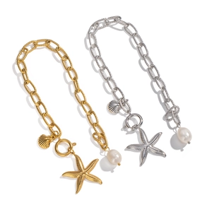 Marine charm bracelet with starfish and pearl pendants in gold and silver finish