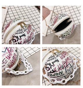 Detailed views of a white basketball shaped bag with colorful graffiti and acrylic chain