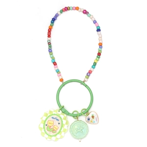 Detail of colorful Evil Eye keychain with green ring, tulip pendant and vibrant beads