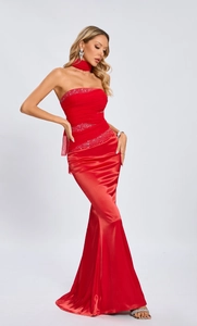 Detail of red satin mermaid evening dress with sparkling rhinestones and elegant draping