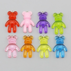 Detail view of 8 colorful resin bear pendants with metal loops for DIY jewelry making