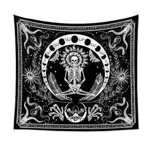 Close-up of black and white gothic tapestry featuring meditating skeleton and moon phases