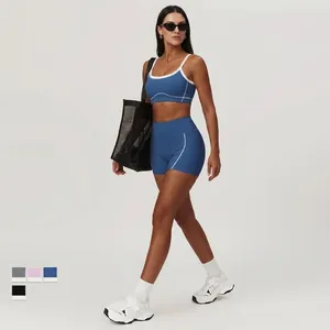 Women's royal blue yoga set with high waist shorts and contrast piping sports bra