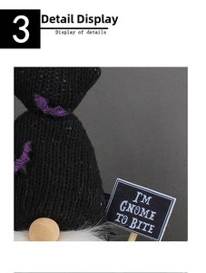Detail of Halloween black knit gnome featuring purple glitter bat and bite sign