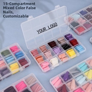 15-grid storage box with mixed color stiletto false nails on a light blue fabric background