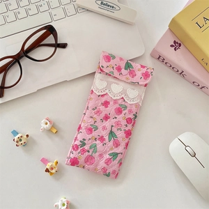 Detailed view of pink floral padded glasses pouch with lace edge and crochet hearts