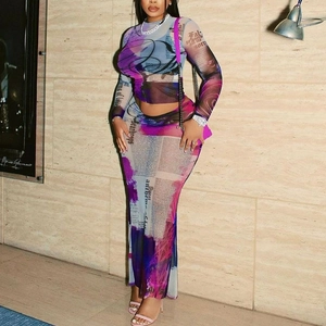 Detail of two-piece mesh set with colorful newspaper print and slim fit design