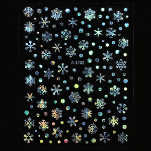 Macro view of A-1709 holographic snowflake nail stickers with rainbow laser metallic effect