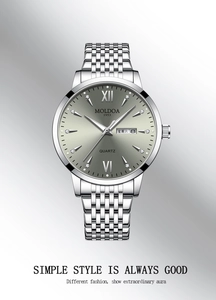 Detail of silver steel men's watch with sunburst dial and day-date display window