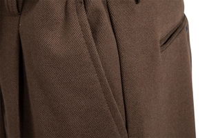 Detail of dark brown twill fabric showing precise stitching and premium texture