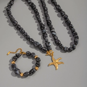 Irregular black resin beaded necklace and bracelet set with golden starfish pendant