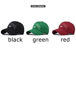 Close-up of NEW YORK 199X 3D embroidery on washed cotton baseball caps in black, green, and red