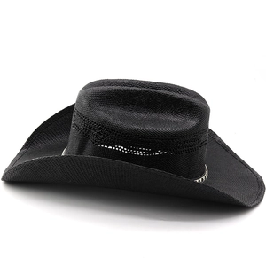 Close-up of the fine woven texture and decorative black and white band on the black cowboy hat