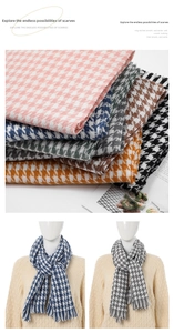 Detail of soft houndstooth scarves in multiple colors with elegant fringed edges