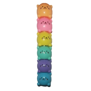Detailed view of six colorful stacked cat-shaped plastic highlighters on white background