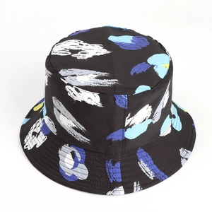 Detailed view of reinforced stitching on black tie-dye bucket hat with abstract print