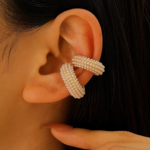 Elegant C-shaped pearl ear cuffs with gold base in a stylish two-piece set for women