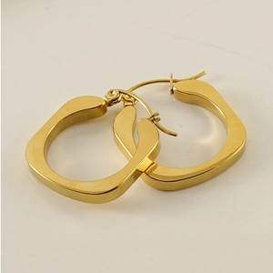Macro shot of gold-plated stainless steel square hoop earrings with a polished finish