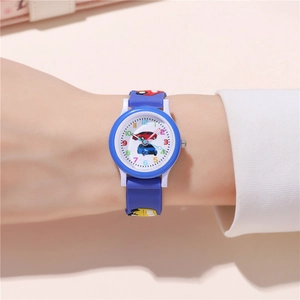 Close-up of kids quartz watch with blue silicone strap and 3D yellow car ornaments