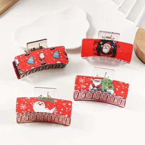 Lot de quatre pinces à cheveux rouges de Noël avec motifs de Père Noël sur fond blanc