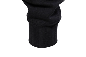 Close-up of the ribbed elastic cuffs on this high-quality black knitted cardigan