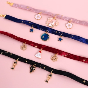 Velvet star and moon pet collars with gold stamping and various charms for cats and dogs