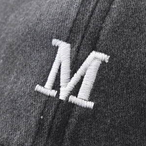 Washed cotton baseball cap with white embroidered M letter detail on grey fabric