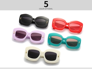 Detailed view of irregular polygon sunglasses with thick frames in five vibrant colors