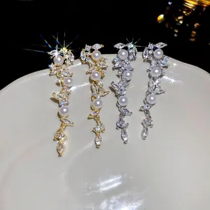 Luxurious tassel drop earrings with marquise zircon and artificial pearls in gold and silver