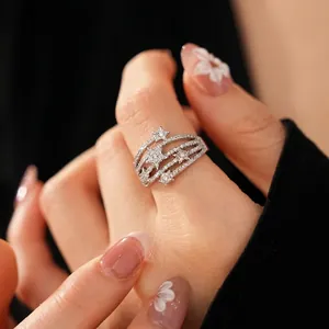Elegant multi-layer silver star open ring with zircon pavé setting on model's hand