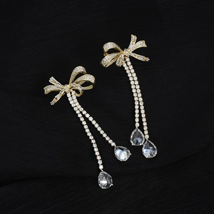Elegant gold bow earrings with micro-set zircon and long water drop tassels