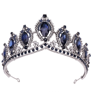 Baroque silver bridal crown featuring deep blue oval gemstones and clear crystals