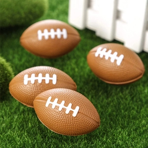 Set of four mini foam American footballs made of PU stress relief material on grass