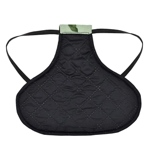 Macro detail of black quilted chicken saddle protector with durable elastic straps