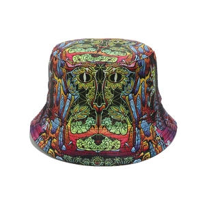 Detailed view of reversible bucket hat with vibrant psychedelic cat face pattern