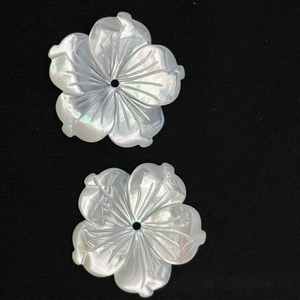 Hand-carved iridescent shell flower petals with center holes for hair pins and brooches