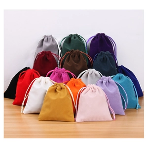 Macro display of colorful velvet drawstring pouches for premium jewelry gift packaging