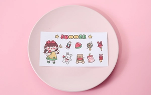 Close-up of cute cartoon stickers with girl, rabbit, and bear patterns for scrapbooking
