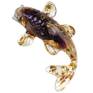 Handcrafted purple amethyst crystal koi fish figurine with gold foil flakes on white background